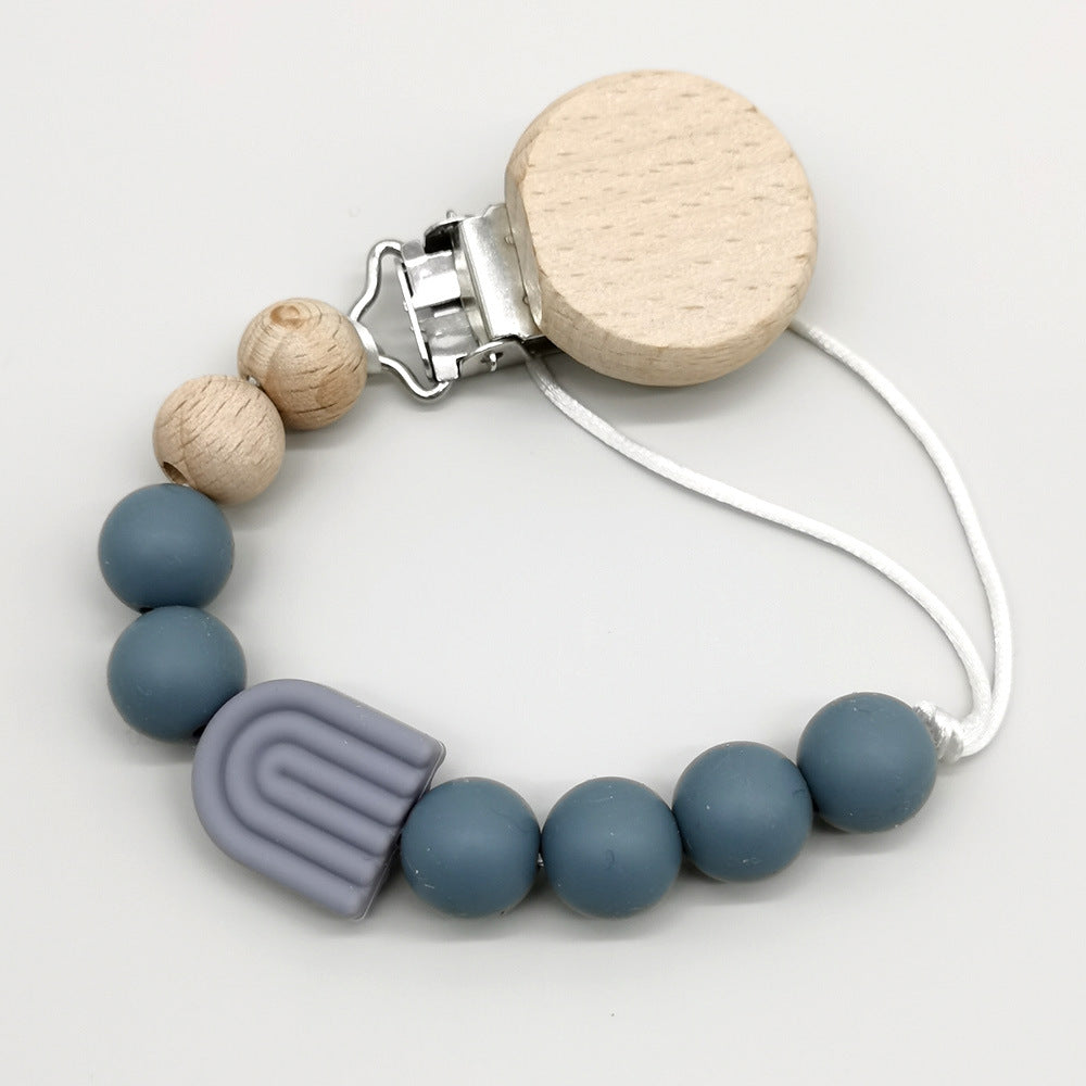 Attache-tétine arc-en-ciel perles bois et silicone