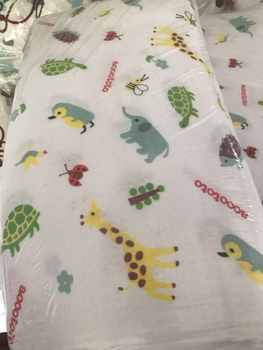 Serviette de bain bébé double gaze motifs enfantins