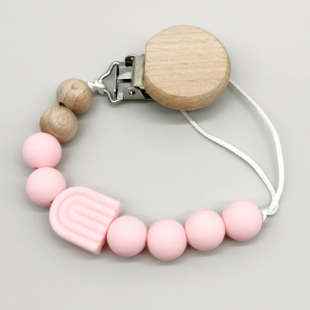 Attache-tétine arc-en-ciel perles bois et silicone